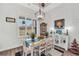 Dining area featuring a rustic table and chairs, a pendant light, and large window at 3911 Peeksville Rd, Locust Grove, GA 30248