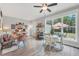Bright dining room with large windows, comfortable seating, and backyard views at 3911 Peeksville Rd, Locust Grove, GA 30248