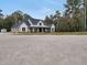 Charming modern farmhouse with black trim, white siding, and inviting front porch at 3911 Peeksville Rd, Locust Grove, GA 30248