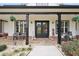 Inviting front porch with stylish decor, seating, and a welcoming double-door entrance at 3911 Peeksville Rd, Locust Grove, GA 30248