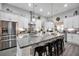 Spacious kitchen with granite countertops, stainless steel appliances, and pendant lighting at 3911 Peeksville Rd, Locust Grove, GA 30248