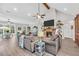 Comfortable living room showcases a brick fireplace, vaulted ceiling, and access to patio at 3911 Peeksville Rd, Locust Grove, GA 30248