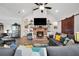 Inviting living room features a brick fireplace, vaulted ceiling, and barn door at 3911 Peeksville Rd, Locust Grove, GA 30248