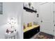 Cozy mudroom bench seating with storage cubbies, complemented by a decorative shelf and floral-patterned lamp at 3911 Peeksville Rd, Locust Grove, GA 30248
