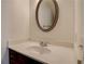 Elegant bathroom vanity with silver-framed mirror and white countertop at 3769 Baxley Point Dr, Suwanee, GA 30024