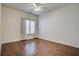 Bright bedroom featuring hardwood floors, neutral walls, and a ceiling fan for comfortable living at 3769 Baxley Point Dr, Suwanee, GA 30024