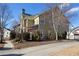 Two-story home featuring a mix of stone and siding, with well-maintained landscaping and mature trees at 3769 Baxley Point Dr, Suwanee, GA 30024