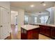 Bright open kitchen with a view to the living room and staircase at 3769 Baxley Point Dr, Suwanee, GA 30024