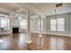 Spacious living area featuring hardwood floors, built-in window seats, and a fireplace at 3769 Baxley Point Dr, Suwanee, GA 30024