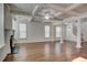 Spacious living area featuring hardwood floors, built-in window seats, and a fireplace at 3769 Baxley Point Dr, Suwanee, GA 30024