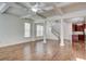 Open-concept living and dining areas with hardwood floors, coffered ceilings, and abundant natural light at 3769 Baxley Point Dr, Suwanee, GA 30024