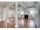 Spacious living area featuring hardwood floors, built-in window seats, and a fireplace at 3769 Baxley Point Dr, Suwanee, GA 30024