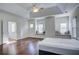 Bright main bedroom with hardwood floors, tray ceiling, and cozy window seats at 3769 Baxley Point Dr, Suwanee, GA 30024