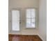 Bright room featuring a door and a window with blinds, enhancing natural light at 3769 Baxley Point Dr, Suwanee, GA 30024
