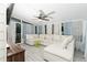 Inviting sunroom featuring a ceiling fan, neutral walls, and comfortable seating at 625 Rockbass Rd, Suwanee, GA 30024