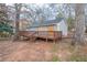 View of the home's backyard featuring a new wooden deck at 112 Oakland Blvd, Stockbridge, GA 30281