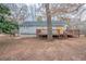 Backyard view of the home featuring a new wooden deck at 112 Oakland Blvd, Stockbridge, GA 30281