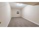 Finished basement with neutral paint, window, and carpeted floors at 112 Oakland Blvd, Stockbridge, GA 30281