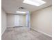 A carpeted bedroom has neutral paint and access to other rooms at 112 Oakland Blvd, Stockbridge, GA 30281