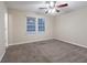 Bedroom with ceiling fan, carpet and a double window at 112 Oakland Blvd, Stockbridge, GA 30281