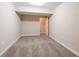 A carpeted bedroom features neutral paint and base trim at 112 Oakland Blvd, Stockbridge, GA 30281