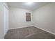 Neutral bedroom featuring plush carpeting, closet and a window at 112 Oakland Blvd, Stockbridge, GA 30281