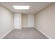 A carpeted bedroom features neutral paint and white doors at 112 Oakland Blvd, Stockbridge, GA 30281
