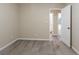 Cozy bedroom with neutral paint, carpet and view into bathroom at 112 Oakland Blvd, Stockbridge, GA 30281