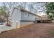 Exterior view of the home, showing the siding and backyard deck at 112 Oakland Blvd, Stockbridge, GA 30281