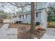Side view of a single-story home with a small partial basement garage and landscaped yard at 112 Oakland Blvd, Stockbridge, GA 30281