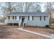 Charming single-story home featuring a cozy front porch and classic architectural details at 112 Oakland Blvd, Stockbridge, GA 30281
