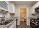 Updated kitchen boasting sleek granite counters, modern cabinetry, and stainless steel appliances at 112 Oakland Blvd, Stockbridge, GA 30281