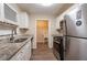 Modern kitchen featuring granite countertops, stainless steel appliances, and ample cabinet space at 112 Oakland Blvd, Stockbridge, GA 30281
