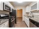 Well-equipped kitchen featuring modern appliances, granite counters, and a seamless design at 112 Oakland Blvd, Stockbridge, GA 30281