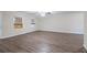 Large, open living room with continuous modern floors, perfect for entertaining guests or Gathering time at 112 Oakland Blvd, Stockbridge, GA 30281