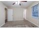 Spacious main bedroom with two entry doors, fan and natural light at 112 Oakland Blvd, Stockbridge, GA 30281