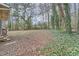 Expansive backyard with mature trees, minimal foliage and some ground cover, offering serene privacy and natural beauty at 2102 Red Berry Sw Ln, Marietta, GA 30008