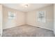 Cozy bedroom with soft carpet, bright windows, and a serene atmosphere at 2102 Red Berry Sw Ln, Marietta, GA 30008