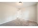 This bedroom features neutral walls, plush carpet, and a convenient access door to the rest of the house at 2102 Red Berry Sw Ln, Marietta, GA 30008
