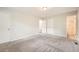 Spacious bedroom with carpet, closet, and access to an ensuite bathroom at 2102 Red Berry Sw Ln, Marietta, GA 30008