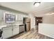 Cozy kitchen showcasing stainless steel appliances, light countertops, and an adjacent dining area at 2102 Red Berry Sw Ln, Marietta, GA 30008