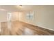 Spacious living room with wood floors, large windows for natural light, and neutral paint at 2102 Red Berry Sw Ln, Marietta, GA 30008