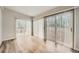 The living room features hardwood floors, two sets of sliding doors, and plenty of natural light at 2102 Red Berry Sw Ln, Marietta, GA 30008