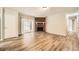Living room featuring hardwood floors, a fireplace, and sliding glass doors leading to the back patio at 2102 Red Berry Sw Ln, Marietta, GA 30008