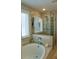 Modern bathroom with a standalone tub and a separate glass-enclosed shower with a showerhead at 2626 Chase Rdg, Kennesaw, GA 30144