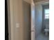 Bathroom featuring a toilet with a window and a linen closet at 452 Eagles Nest Cir, Auburn, GA 30011