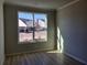 Bedroom with a large window offering natural light and views of the neighborhood at 452 Eagles Nest Cir, Auburn, GA 30011