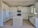 Bright white kitchen featuring a center island, stainless steel appliances, and modern finishes at 452 Eagles Nest Cir, Auburn, GA 30011