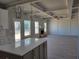 Bright living room featuring hardwood floors, fireplace, coffered ceilings, and pendant lights at 452 Eagles Nest Cir, Auburn, GA 30011