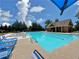 Community pool features clear blue water, ample seating, and a diving board at 452 Eagles Nest Cir, Auburn, GA 30011